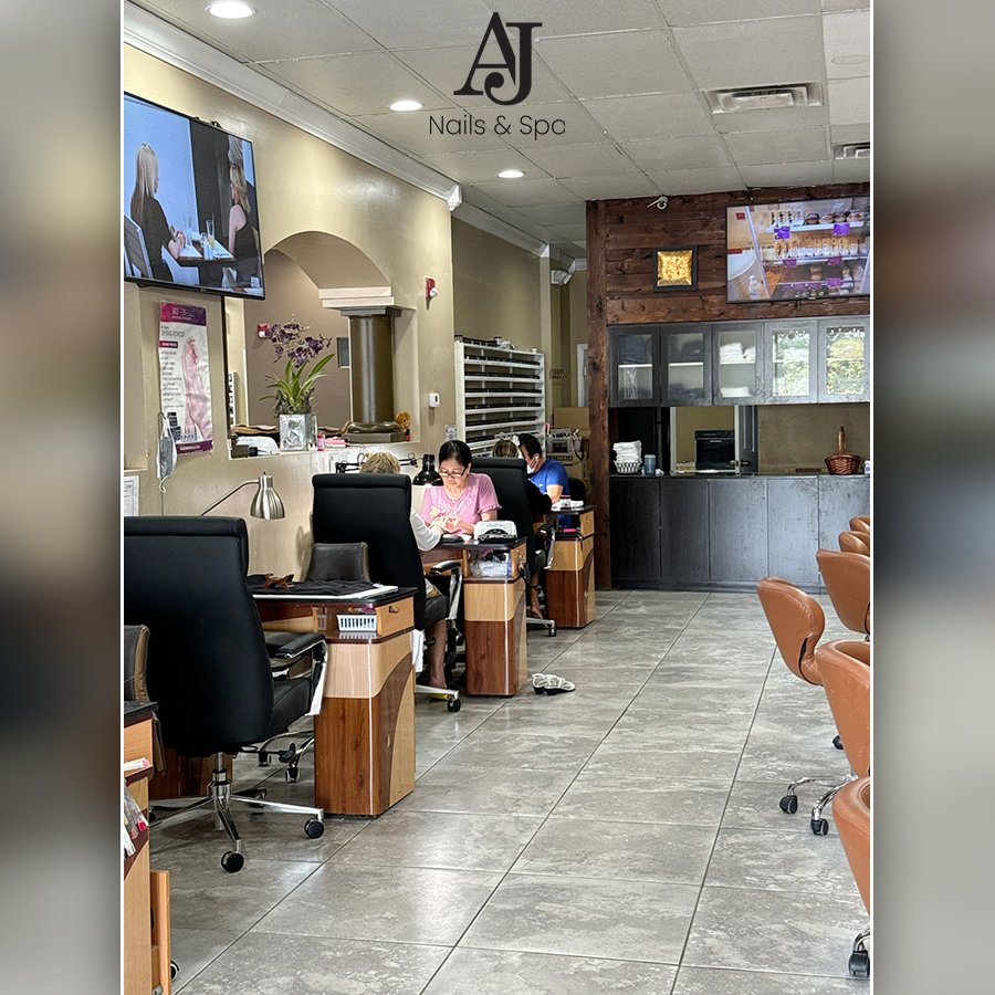 Nail technician shaping nails during service